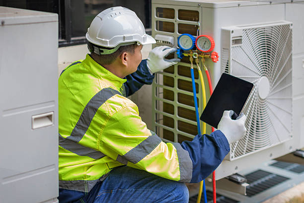Professional Emergency Ac Repair technician working in Howes Cave, NY